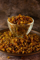 Pile of Organic dried Raisins on black background