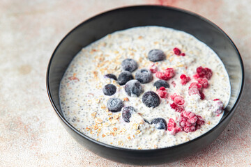 oatmeal porridge chia seeds and berries breakfast fresh healthy meal food diet on the table copy space food background 