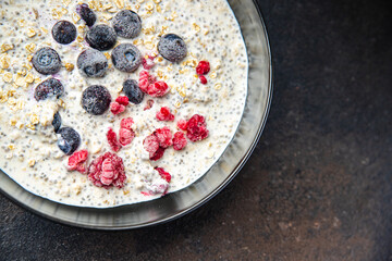 oatmeal porridge chia seeds and berries breakfast fresh healthy meal food diet on the table copy space food background 