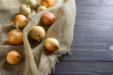 Fototapeta na wymiar onions on a wooden background. Selective focus.