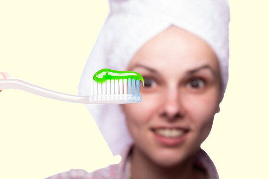 Woman Holding A Toothbrush With Toothpaste