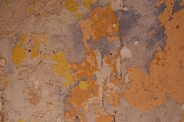 Abstract closeup of peeling paint on cement wall