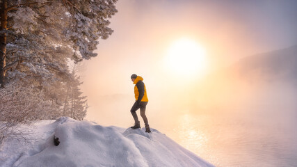 Man in frost bright sunny winter day. Adventure, outdoor activities, healthy lifestyle.