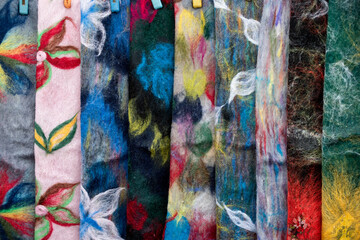 Abstract close-up detail of colorful wool scarves.