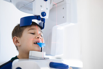 Panoramic x-ray examination for a teeth of little boy at dental clinic