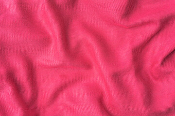 Fototapeta na wymiar wrinkled pink fabric texture background close up