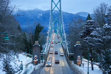 View of Lions Gate suspension Bridge in Vancouver, British Columbia, Canada at night in winter full...