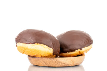 Two flavored chocolate donuts on a wooden saucer, macro, isolated on a white background.