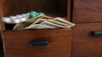 Fototapeta na wymiar Dollars, banknotes in a box, drawer