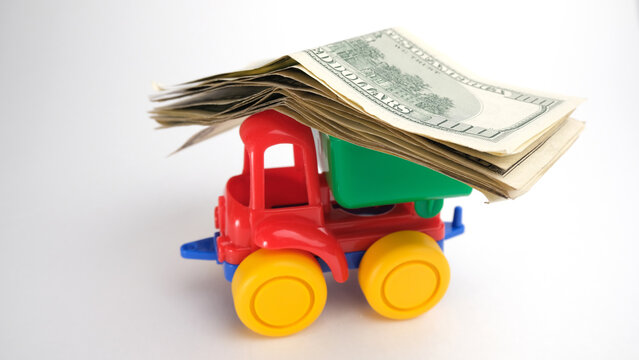 Toy truck carrying dollar bills
