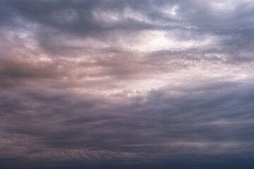 Dense dark clouds. The sky at sunset, late at night.