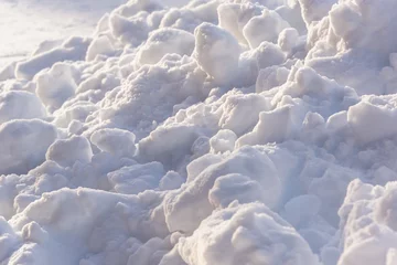 Tuinposter Snowballs, blockage on the road in winter. © Ilya