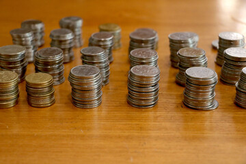 group of stack currency coins on table - Image