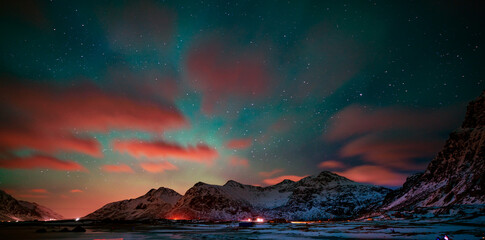 Night clouds in the starry sky over the mountains in Norway