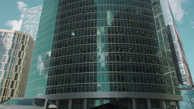 smooth panoramic video of glass skyscraper shot from bottom to top