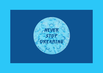 'Never stop dreaming' in a blue sphere with drops, isolated on a blue background.