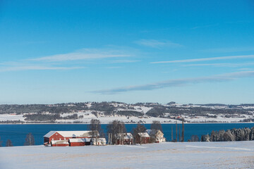 a farm by Lake Mjøsa in winter