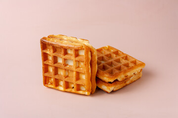 Viennese waffles on a pink background close-up