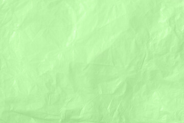 Obraz na płótnie Canvas Crumpled kraft paper or cardboard texture for green background