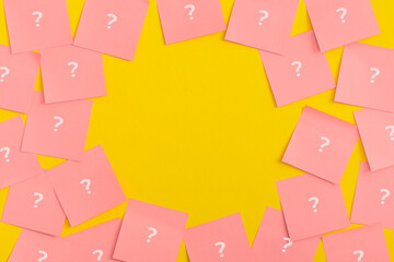 Sticky notes on yellow background. Question mark.
