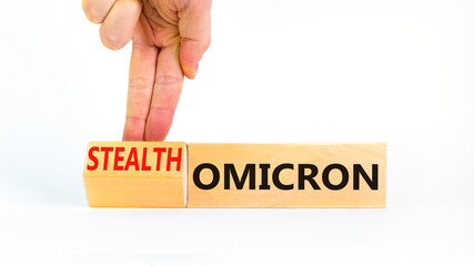 Covid-19 stealth omicron symbol. Doctor turns a cube and changes the word omicron to stealth...
