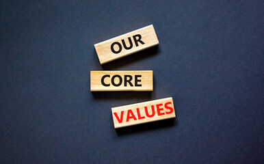 Our core values symbol. Concept words Our core values on wooden blocks on a beautiful black table black background. Business value and our core values concept. Copy space. - obrazy, fototapety, plakaty