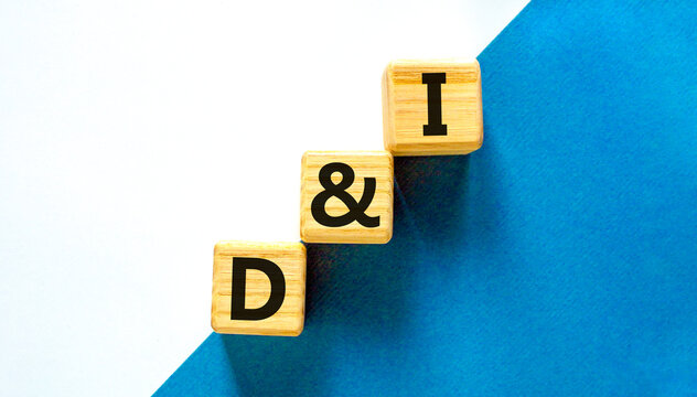 D and I, Diversity and inclusion symbol. Concept words D and I, diversity and inclusion on wooden cubes on beautiful white background. Business, D and I, diversity and inclusion concept.