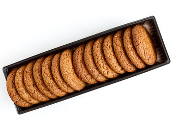 Oatmeal cookies in the package are isolated on a white background.