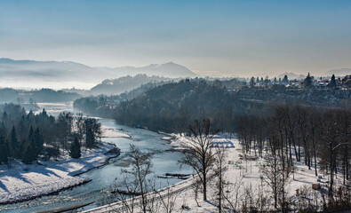 The view over the snowy mid-December landscape from the city walls of Belluno, in Veneto, north east Italy
