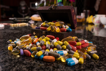 Treasure box filled with prescription medication painkillers tablets pills and capsules