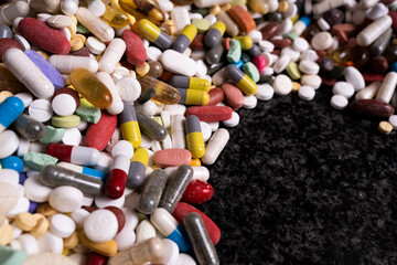 Assorted compilation of pills and capsules. the unfortunate truth of medication pill and drug abuse.
Rips family apart 
