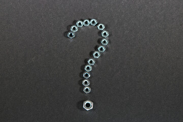question mark made of nuts for bolts