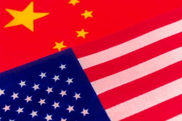 Fototapeta premium USA vs China conflict concept. Flags of United States of America and China. Economy and politics photo