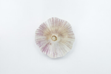 Head of garlic (Allium sativum) with its units still in the bulb and husk on a neutral background