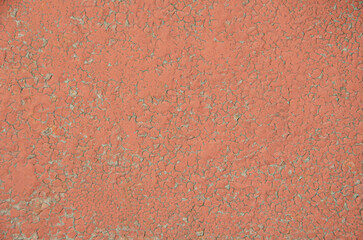 Fototapeta premium Selective focus old brown cracked paint. The texture of the old rusty paint with cracks. Dried in the sun and cracked color on the wall of country house. Peeling coating.