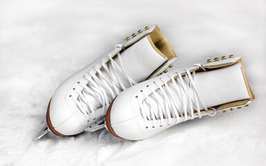 Pair of white figure skates.