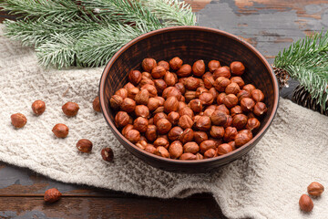 Hazelnut, hazelnut in a cup on a wooden background