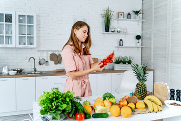Natural young happy vitamin nutrition. Attractive woman with fruit in hands.