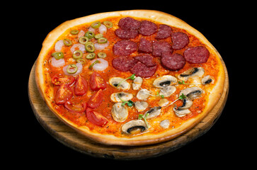 Pizza, a traditional Italian snack. Lots of ingredients, cheese, tomatoes, sauce, shrimp, salami, champignen mushrooms, olives. Isolated on black background.
