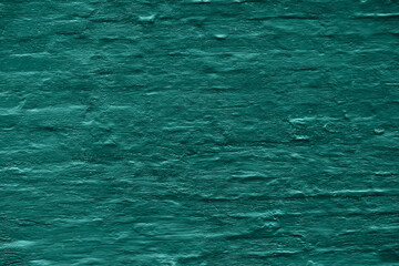 Teal painted old brick Wall horizontal background. Natural abstract backdrop image of old brickwall texture close-up, toned in velvet jade.