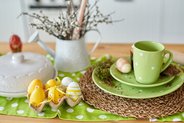 yellow Easter eggs on the table in the kitchen for decoration