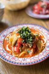 Central Asian Noodle Soup or Stew Lagman with Lamb Meat and Vegetables Garnished with Fresh Parsley