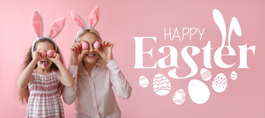 Happy little girl and her grandmother with bunny ears and Easter eggs on pink background