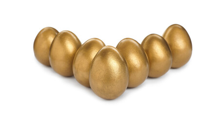Many shiny golden eggs on white background