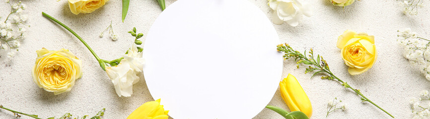 Blank card with beautiful fresh flowers on light background