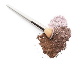 Makeup brush and loose eye shadow on white background