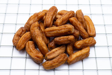 Sun-dried bananas on white background.