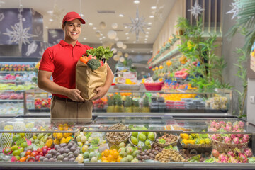Shop assistant in a grocery behind a counter