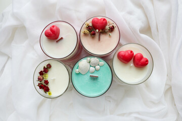 gift concept for valentine's day. aroma candle in a glass of natural soy wax. dry flowers and red heart
