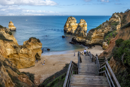 The wooden staircase to a beach with cliffs in Camile and Boneca, Lagos